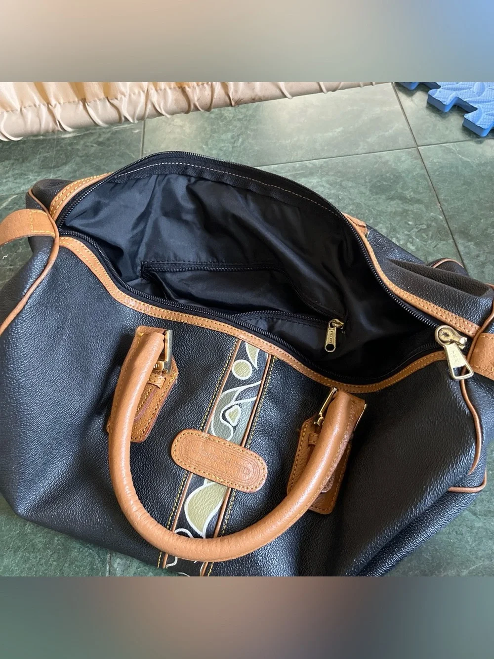 Black Leather Duffel Bag with Brown Trim and Olive Pattern Accent